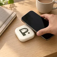 A phone being tapped on the Pause Device