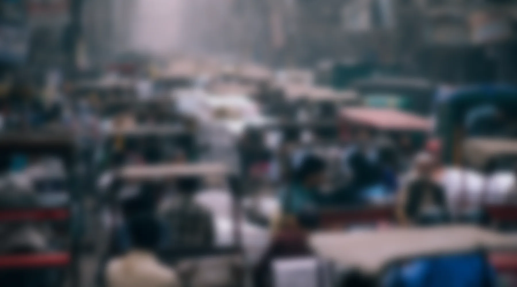 A crowded New Delhi street, blurred.